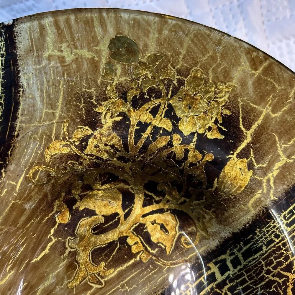 Glass bowl features an asymmetrical shape with a striking black and gold crackle